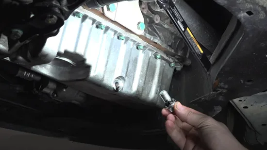 What happens if you put an oversized drain plug during an oil change?